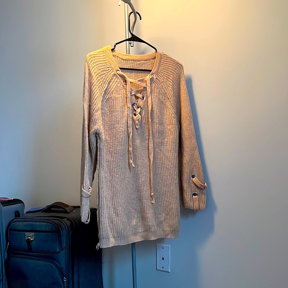 Tan cable knit sweater with metal detailing
